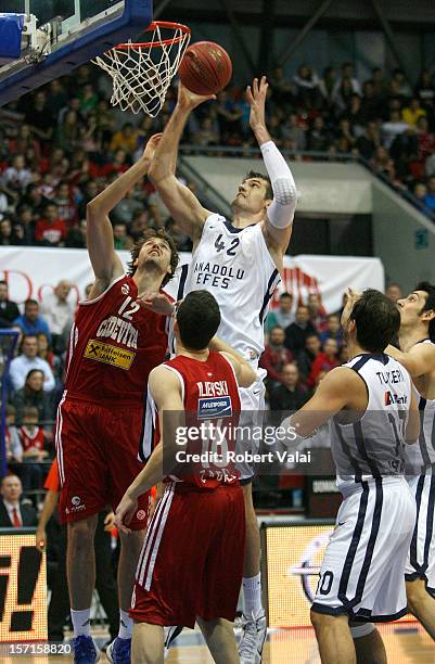 Luksa Andric, #12 of Cedevita Zagreb competes with Stanko Barac, #42 of Anadolu Efes during the 2012-2013 Turkish Airlines Euroleague Regular Season...