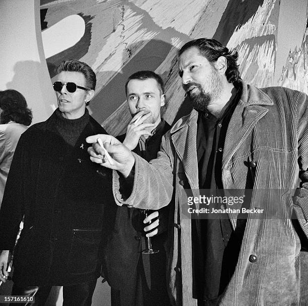 Singer David Bowie, artists Damien Hirst and Julian Schnabel are photographed for Vanity Fair Magazine on May 3, 1996 at Damien Hirst's opening at...