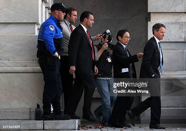 Followed by reporters, U.S. Secretary of Treasury Timothy Geithner leaves the Capitol after meetings with congressional leaders November 29, 2012 on...