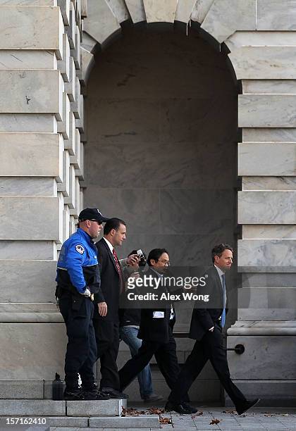Followed by reporters, U.S. Secretary of Treasury Timothy Geithner leaves the Capitol after meetings with congressional leaders November 29, 2012 on...