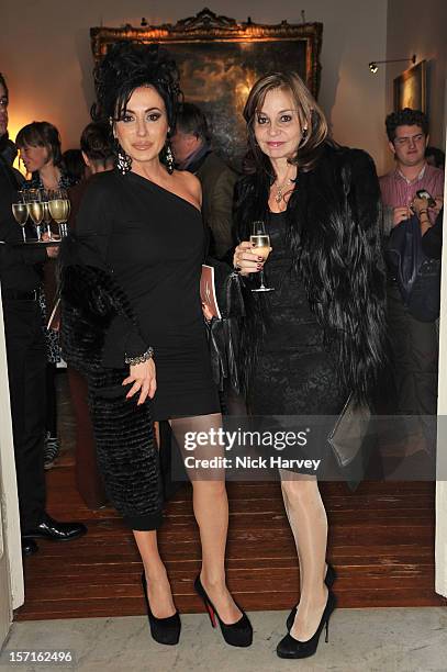 Nancy Dell'Olio and guest attend a catwalk show and auction hosted by Browns, Harpers Bazaar and H.E. Alain Giorgio Maria Economides in aid of Women...