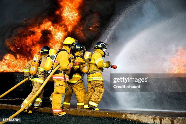 fire fighting - extinguishing stockfoto's en -beelden