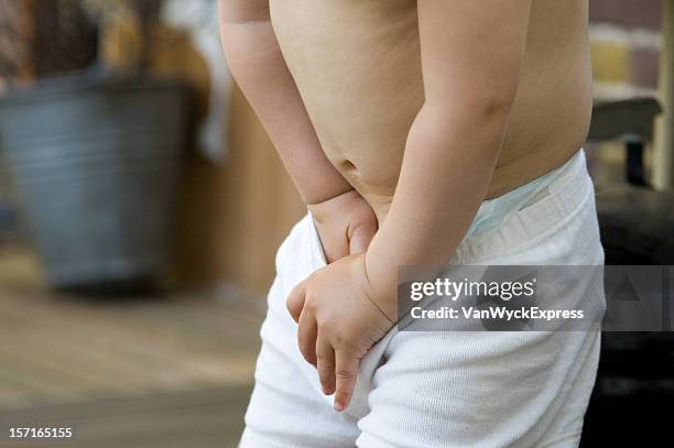 need to pee? - child urinating stock pictures, royalty-free photos & images