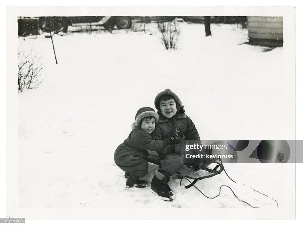 Two Asian Children Playing in the Snow