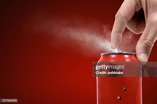 person opening can of carbonated beverage - spray on hand stock pictures, royalty-free photos & images