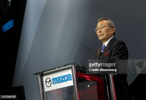 Takashi Yamanouchi, chief executive officer of Mazda Motor Corp., speaks during the LA Auto Show in Los Angeles, California, U.S., on Thursday, Nov....