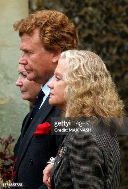 Hayley Mills , her brother Jonathan, and sister Juliette, follow their father's coffin, actor Sir John Mills, to his last resting place after his...