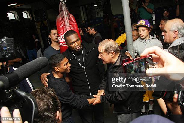 Yuriorkis Gamboa, Curtis Jackson and Bob Arum attend a Los Angeles media workout held at Fortune Gym on November 29, 2012 in Los Angeles, California.