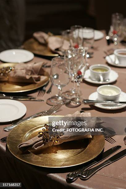 gold plates at the wedding dinner - gold fork and knife stock pictures, royalty-free photos & images