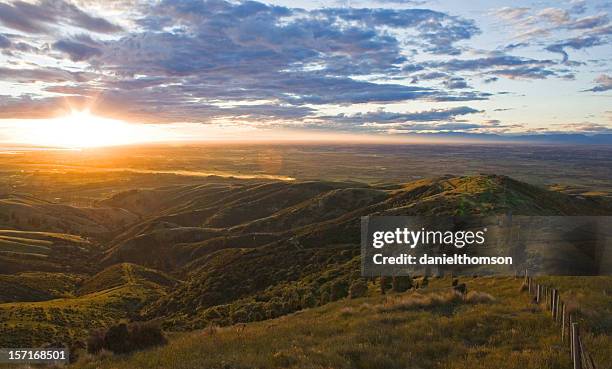 sunset over canterbury plains - canterbury plains stock pictures, royalty-free photos & images