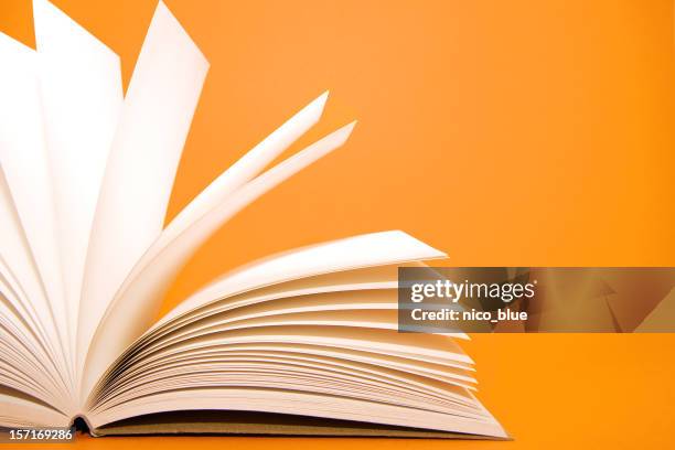 notes on orange - turning page stock pictures, royalty-free photos & images