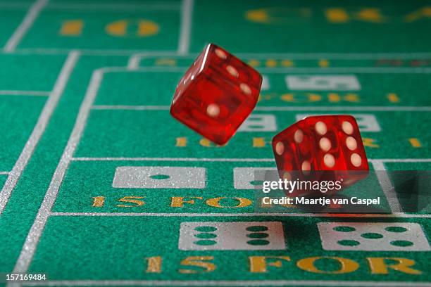 rolling the dice - red dice stock pictures, royalty-free photos & images