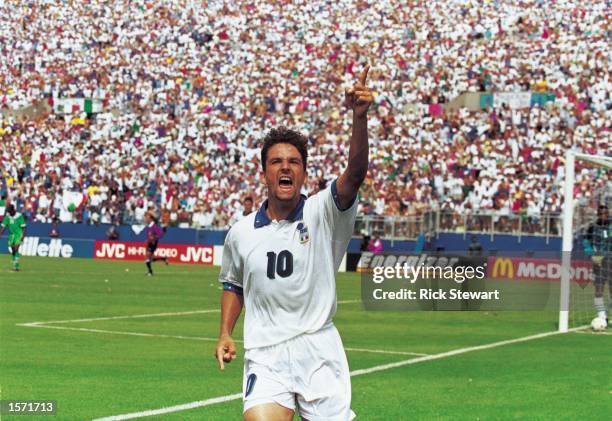 Roberto Baggio of Italy celebrates scoring the winning goal during the FIFA World Cup Finals 1994 second round match against Nigeria played at the...