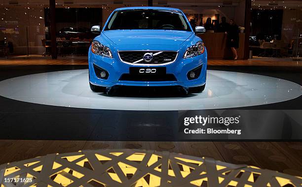 The Volvo AB C30 vehicle sits on display at the company's booth during the LA Auto Show in Los Angeles, California, U.S., on Thursday, Nov. 29, 2012....