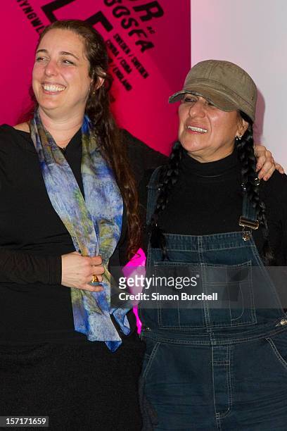 Tania Bruguera poses with and Teresa Margolles as Margolles is announced as the winner of the Artes Mundi 5 prize at the National Museum Cardiff by...