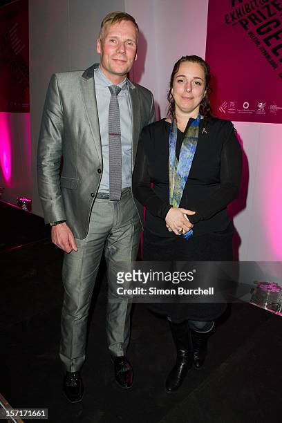Paul Hobson and Tania Bruguera pose as Teresa Margolles was today announced as the winner of the Artes Mundi 5 prize at the National Museum Cardiff...