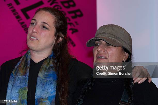 Tania Bruguera poses with and Teresa Margolles as Margolles is announced as the winner of the Artes Mundi 5 prize at the National Museum Cardiff by...