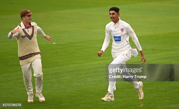 Shoaib Bashir of Somerset celebrates the wicket of Tom Latham of Surrey for 99 with team mate Tom Abell during Day Two of the LV= Insurance County...