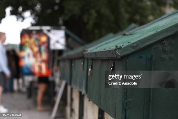 The traditional outdoor booksellers are seen on the Seine River in Paris, France on July 29, 2023. Les Bouquinistes that have been there for years to...