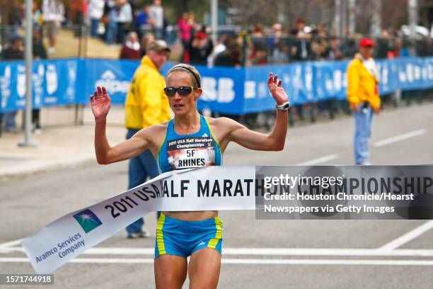 Jen Rhines crosses the finish line to win the Women's 2011 USA Half Marathon National Championships Saturday, Jan. 29 in Houston.