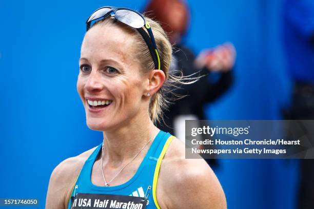 Jen Rhines reacts after crossing the finish line to win the Women's 2011 USA Half Marathon National Championships Saturday, Jan. 29 in Houston.