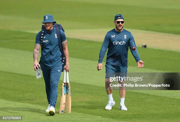 Ben Stokes and Brendon McCullum walk across the field during a training session before the 5th Test between England and Australia at The Kia Oval on...