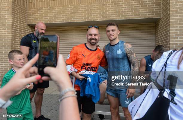 Kieran Trippier poses for photos with fans during the Pre Season Open Training session at the PACE Academy on July 25, 2023 in Atlanta, Georgia.
