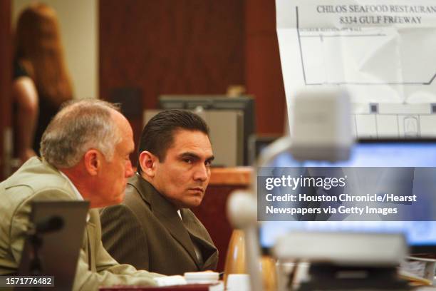 Jamie Zamora reacts as he sits beside is lawyer, Paul Looney, during his trial at the 185th Court, Tuesday, March 8 in Houston. Last year, Zamora was...