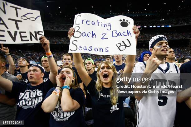 Butler fans, Kassy Fernsler , Lindsey Helm and Kevin Schwartz cheer during the first half of the Butler vs VCU Semifinals matchup during the NCAA...