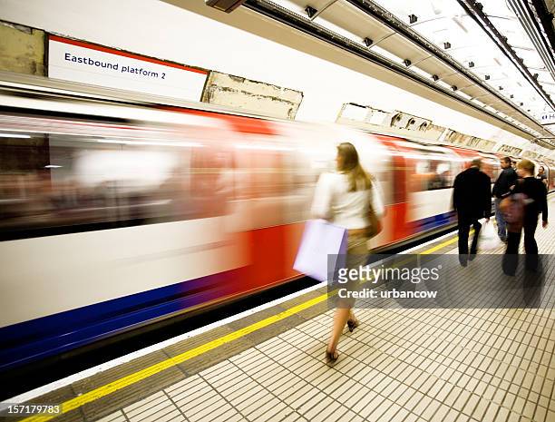 catching the tube - london underground train stock pictures, royalty-free photos & images