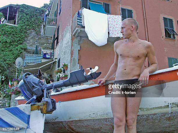 gigolo in italy (or checking out girls) - young men in speedos 個照片及圖片檔