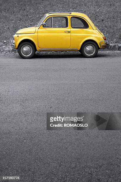 yellow vintage car on grey, rome italy - yellow car stock pictures, royalty-free photos & images