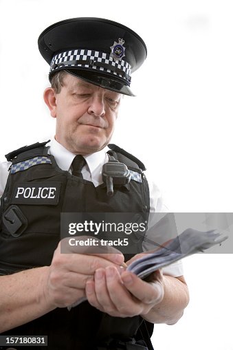 Uk Policeman A Uniformed Officer Taking Notes From A Case High-Res ...