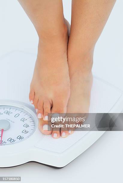 cheating in the scale - ankle weights stock pictures, royalty-free photos & images