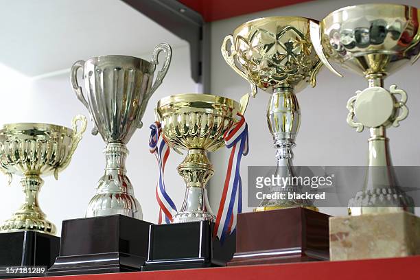 group of trophies - championship stock pictures, royalty-free photos & images