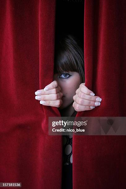 looking through red curtains - hide behind stock pictures, royalty-free photos & images