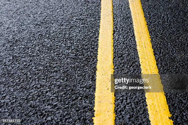 double yellow line - road signs & markings stock pictures, royalty-free photos & images