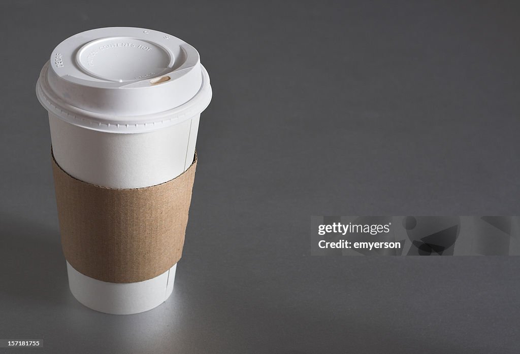 Average Coffee Cup With Blank Sleeve To Advertise Coffee High-Res