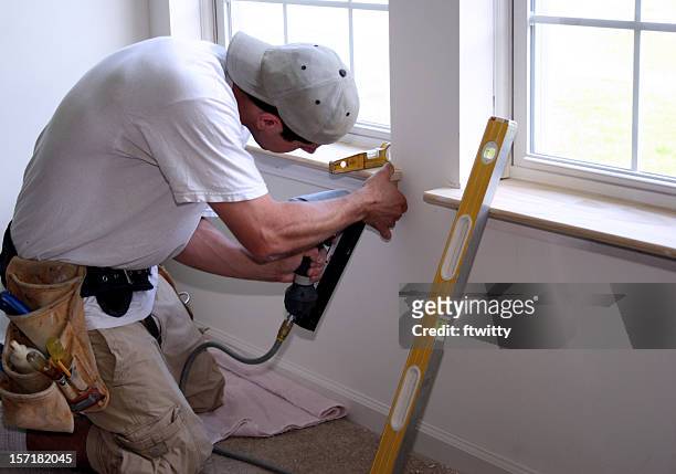 employee diligently working in summer time on window - window sill stock pictures, royalty-free photos & images