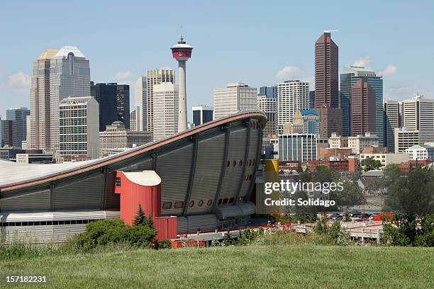 calgary alberta skyline with saddledome - calgary saddledome stock pictures, royalty-free photos & images