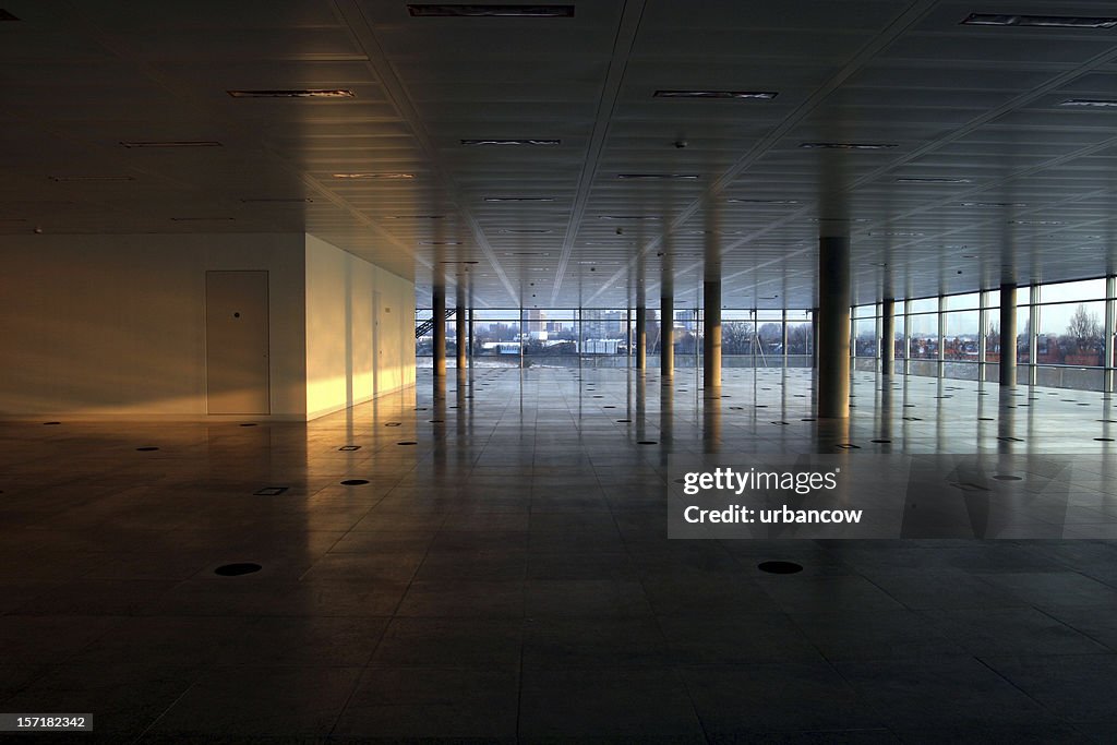 Empty office interior, lit wall