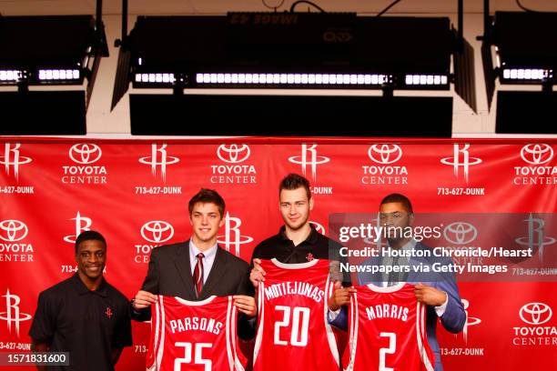 Newly acquired player, Jonny Flynn stands next to Houston Rocket's 2011 NBA Draft picks, Chandler Parsons, Donatas Motiejunas, and Marcus Morris...