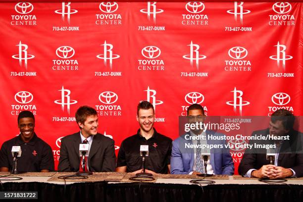 Newly acquired player, Jonny Flynn sits next to Houston Rocket's 2011 NBA Draft picks, Chandler Parsons, Donatas Motiejunas, Marcus Morris, and head...