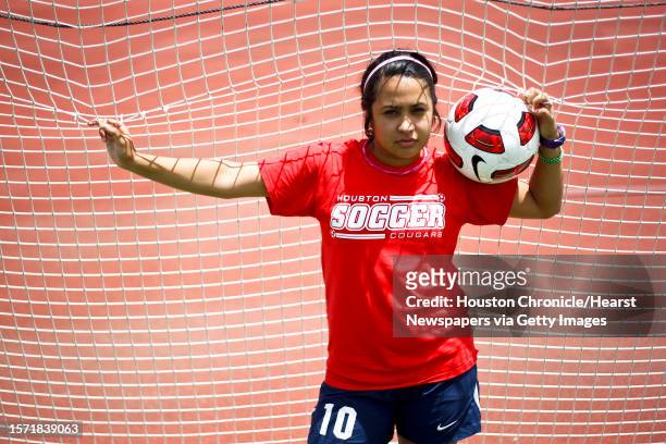 University of Houston soccer player Morgan Vela, holds a ball at the Carl Lewis International Track and Field Complex, Monday, July 11 in Houston.