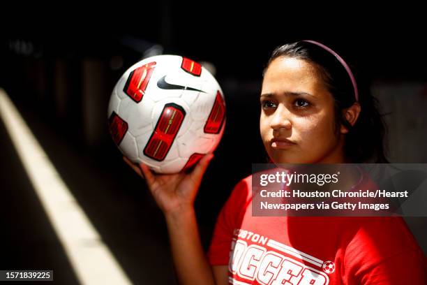 University of Houston soccer player Morgan Vela, holds a ball at the Carl Lewis International Track and Field Complex, Monday, July 11 in Houston.