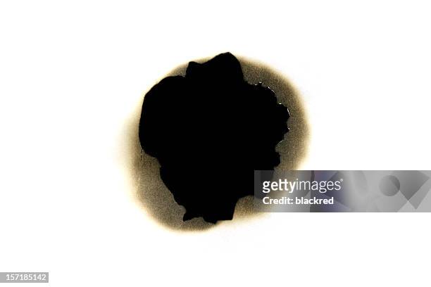 bullet hole - torn reveal textured paper stock pictures, royalty-free photos & images