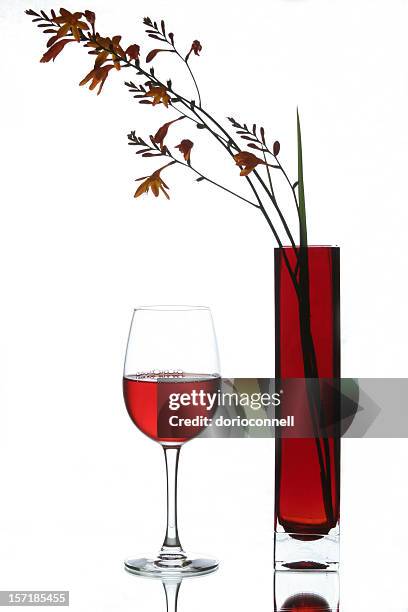 wine glass and red vase - bar drink establishment stock pictures, royalty-free photos & images