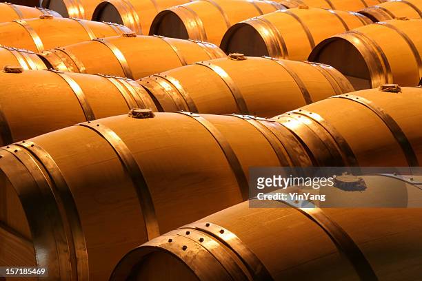 wine barrels in winery cellar of napa valley california - napa california 個照片及圖片檔