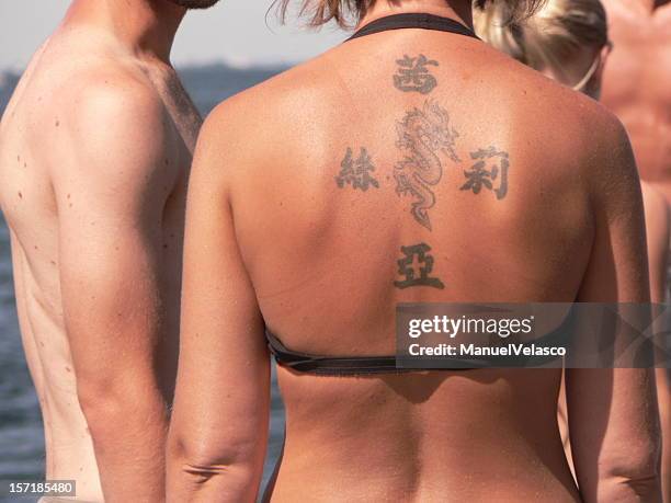 dragon tattoo girl - chinese script stock pictures, royalty-free photos & images