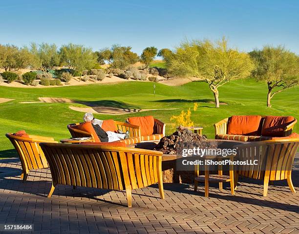 relaxing by the fire pit - golf terrace stock pictures, royalty-free photos & images